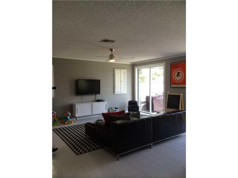 10096 Country Brook Road Boca Raton, FL 33428 - Photo 9 of 29 a living room with furniture and a flat screen tv