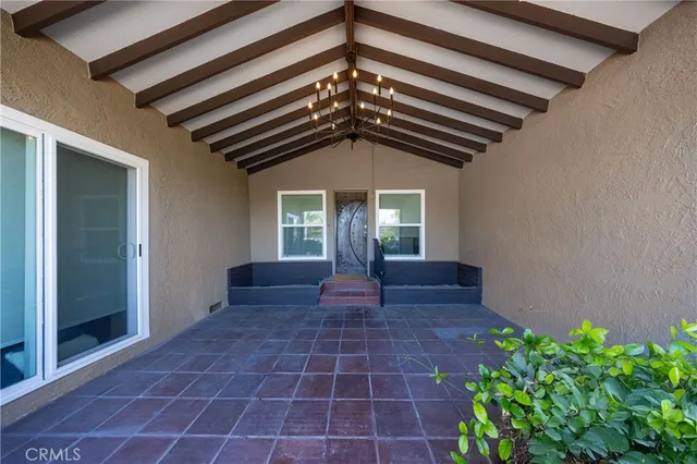 a view of entryway with flower pots