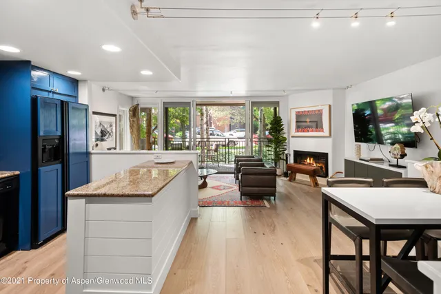a living room with fireplace furniture and a flat screen tv