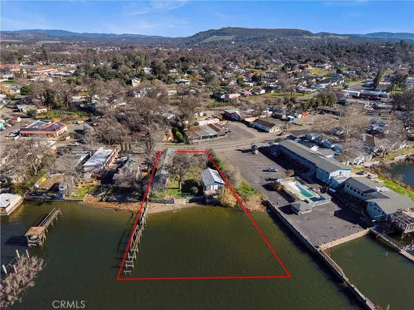 an aerial view of a house with a lake view