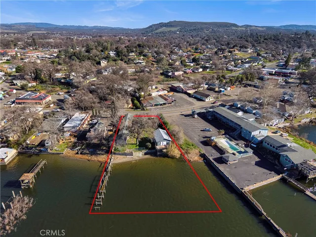 an aerial view of a house with a lake view