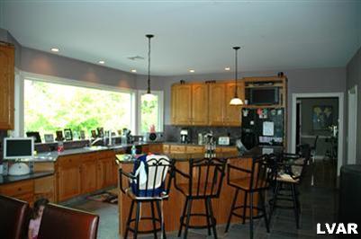 765 Texas Road Easton, PA 18042 - Photo 8 of 28 a view of a dining room with furniture window and outside view