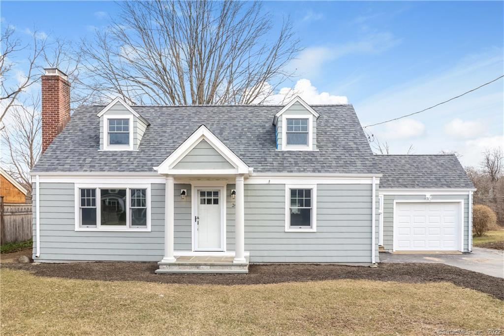 24 Ryegate Road Fairfield, CT 06824 - Photo 1 of 1 a front view of a house with a yard