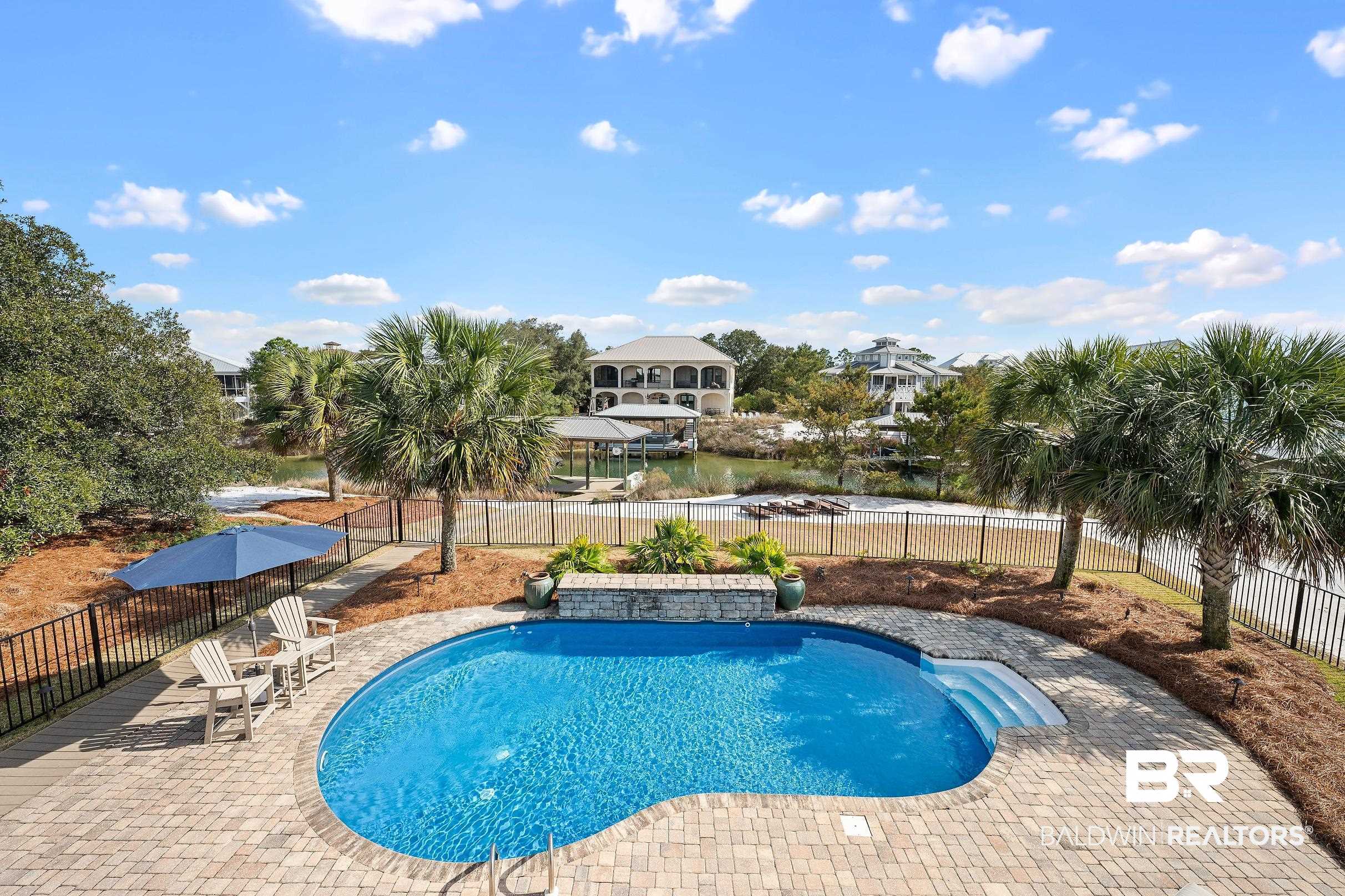 33186 Marlin Key Drive Orange Beach, AL 36561 - Photo 28 of 87 View of pool featuring patio surround and a fenced backyard