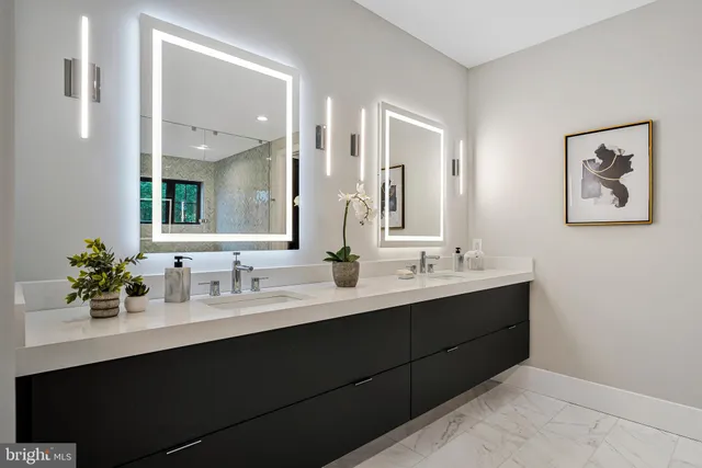 a bathroom with a double vanity sink a mirror and shower