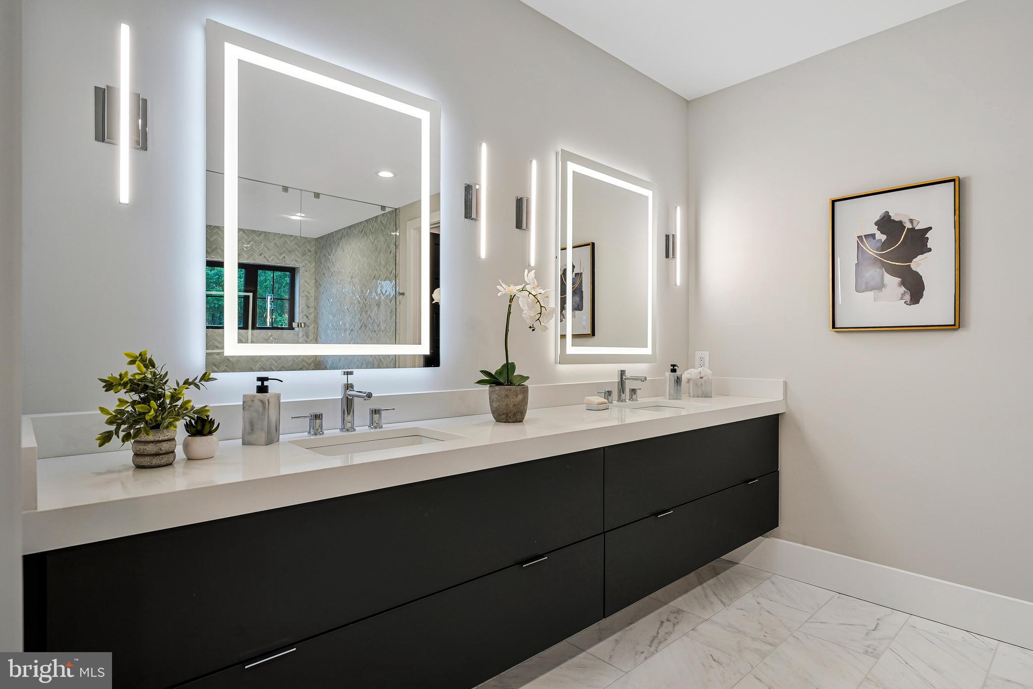 11410 Waples Mill Road Oakton, VA 22124 - Photo 13 of 104 a bathroom with a double vanity sink and a mirror