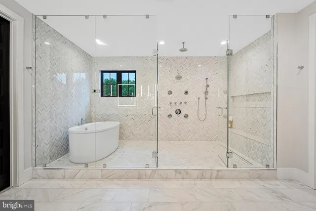 a bedroom with a large bed and a painting on the wall