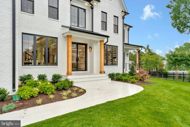 a bedroom with a large bed and a large window