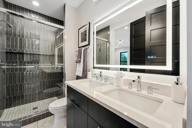 a view of hallway with wooden floor and a potted plant