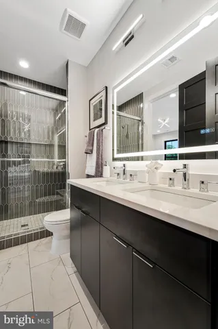 a open dining room with stainless steel appliances granite countertop a stove a kitchen island a dining table and chairs