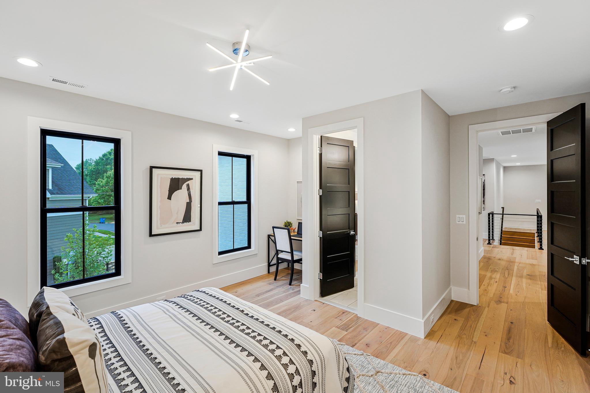 11410 Waples Mill Road Oakton, VA 22124 - Photo 26 of 104 a bedroom with a bed and a dresser with rug