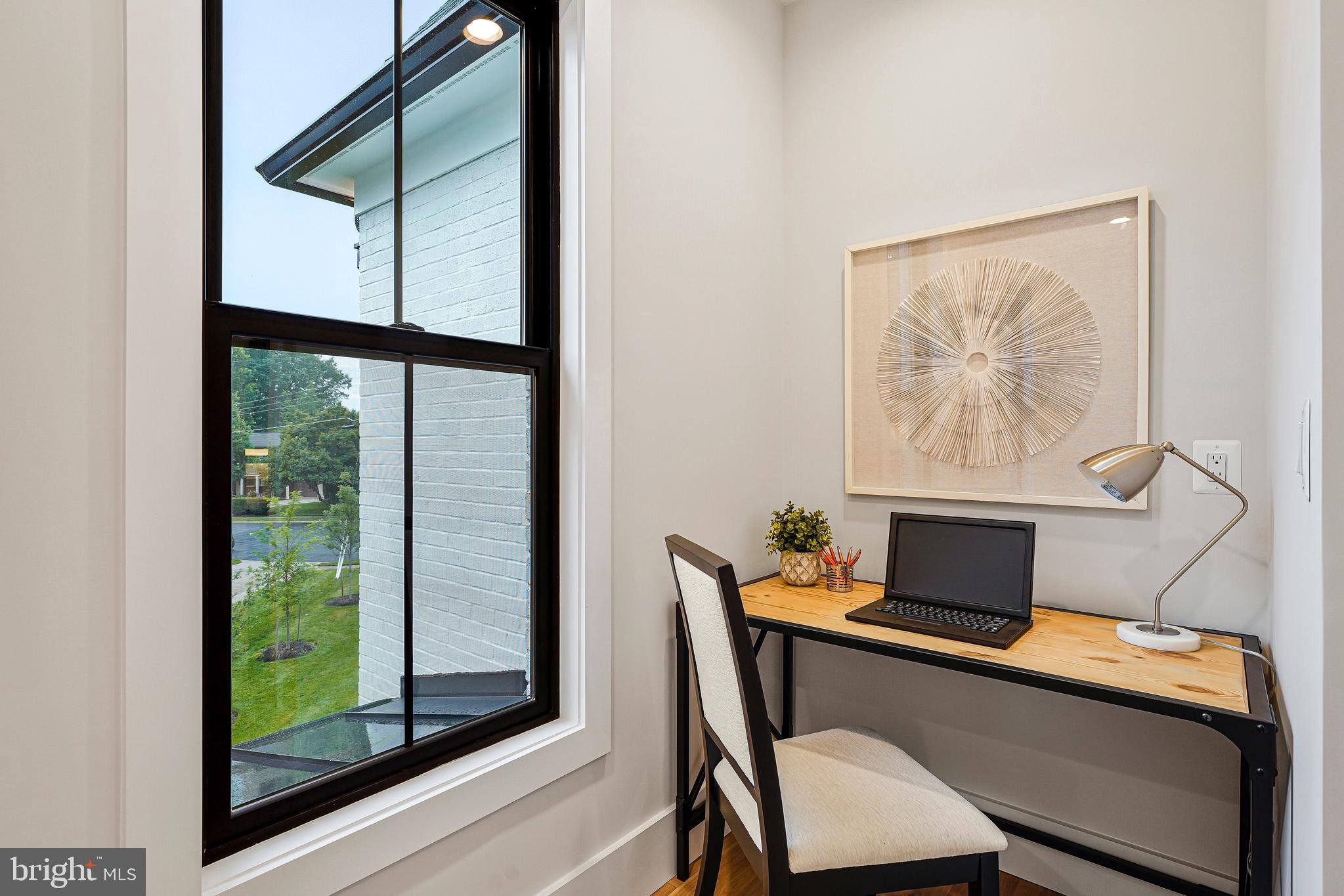 11410 Waples Mill Road Oakton, VA 22124 - Photo 27 of 104 a view of a workspace with furniture and a window