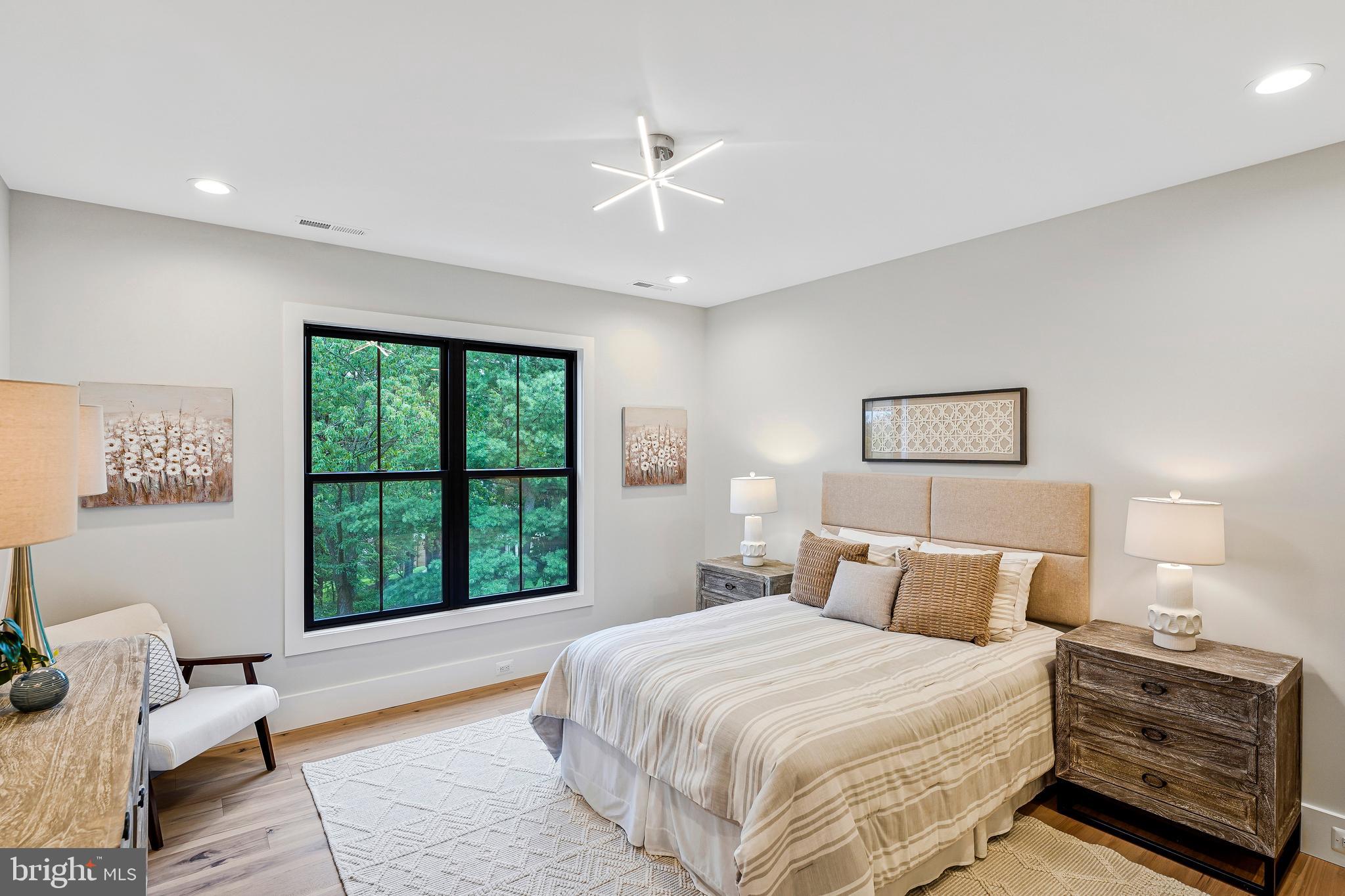 11410 Waples Mill Road Oakton, VA 22124 - Photo 29 of 104 a bedroom with a large bed and a window