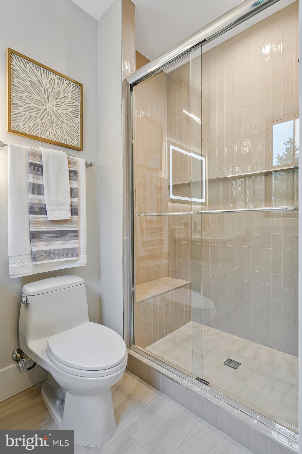 11410 Waples Mill Road Oakton, VA 22124 - Photo 33 of 104 a bathroom with a toilet and a shower