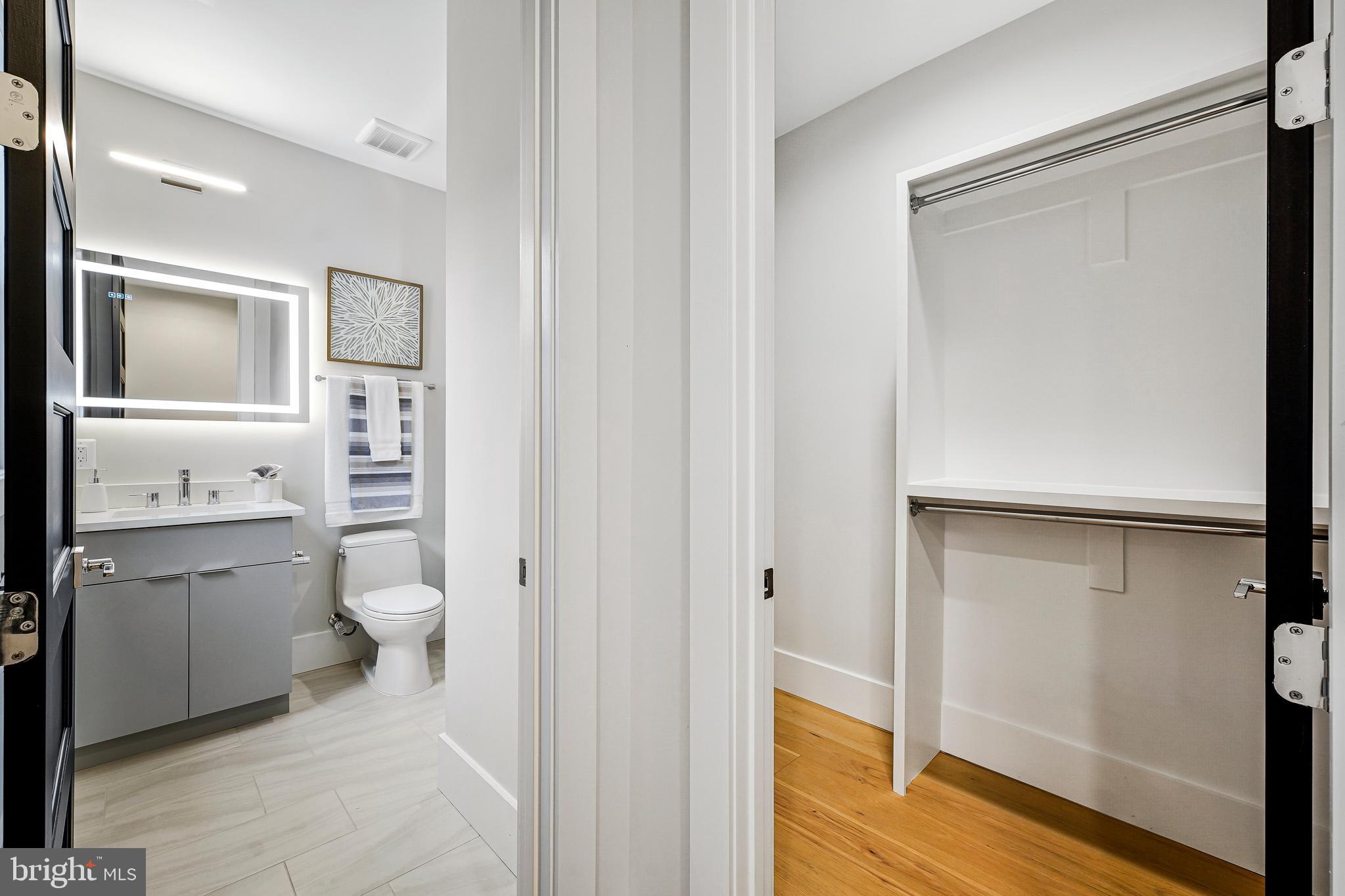 11410 Waples Mill Road Oakton, VA 22124 - Photo 34 of 104 a bathroom with a granite countertop sink toilet and shower