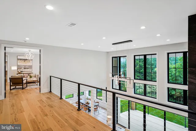a view of livingroom with hardwood floor and a ceiling fan