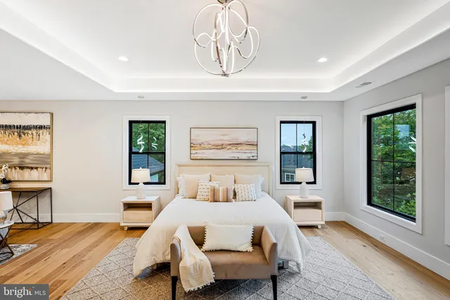 a living room with furniture a rug and a large window