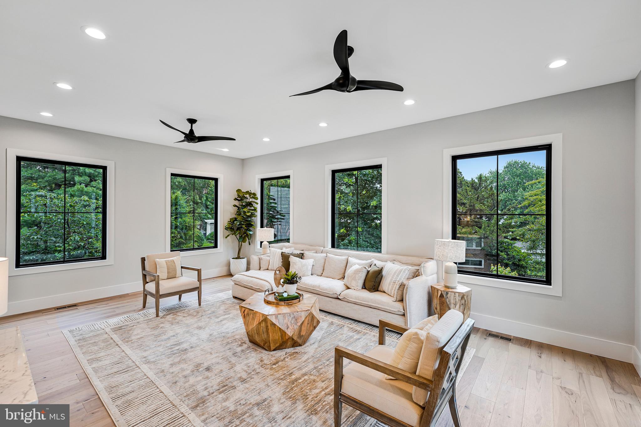 11410 Waples Mill Road Oakton, VA 22124 - Photo 64 of 104 a living room with furniture and a large window