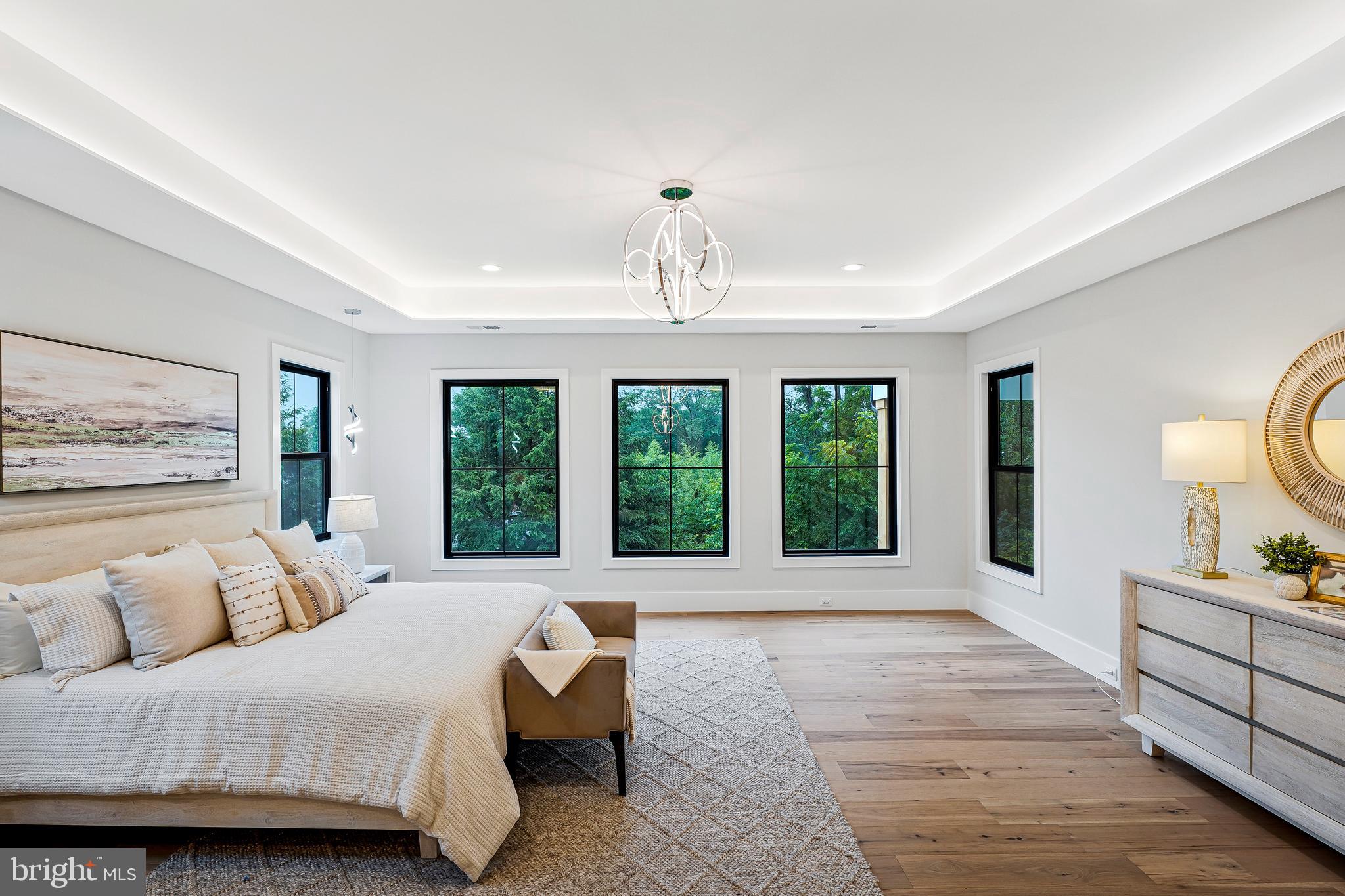11410 Waples Mill Road Oakton, VA 22124 - Photo 7 of 104 a spacious bedroom with a large bed and a large window