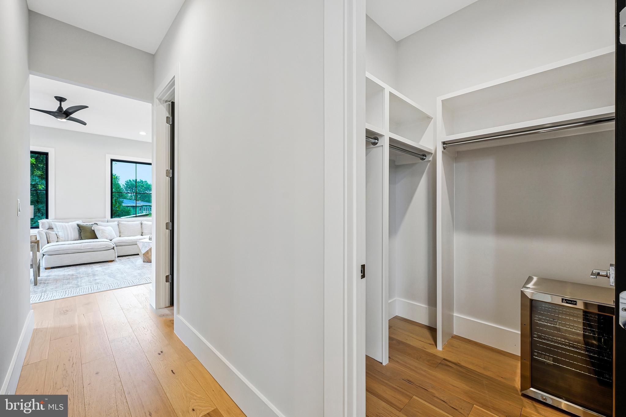 11410 Waples Mill Road Oakton, VA 22124 - Photo 72 of 104 a view of livingroom with hardwood floor and a ceiling fan