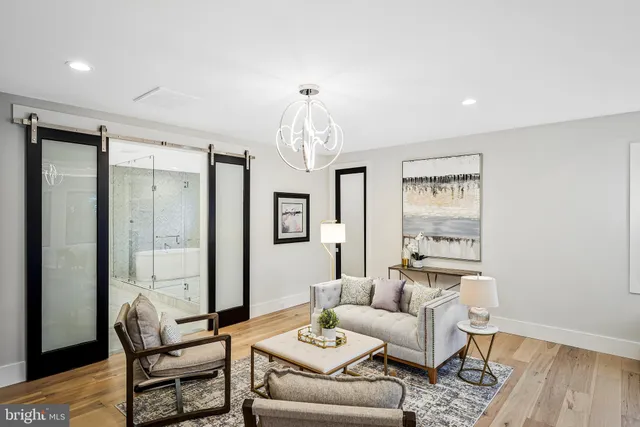 a room with walk in closet and wooden floor