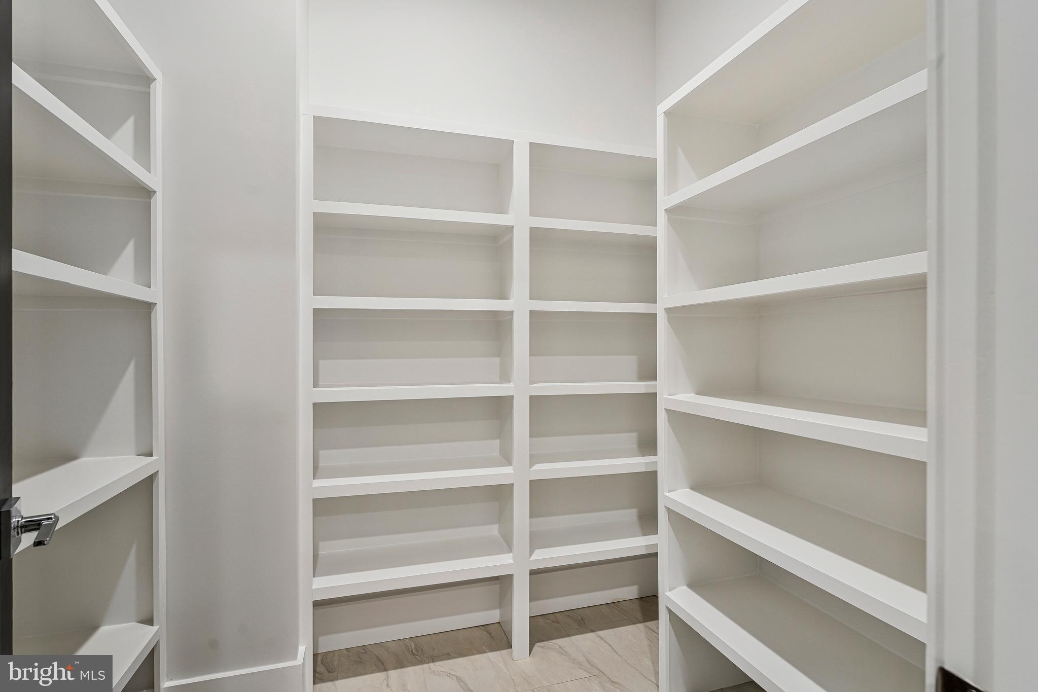 11410 Waples Mill Road Oakton, VA 22124 - Photo 93 of 104 a view of walk in closet with empty racks