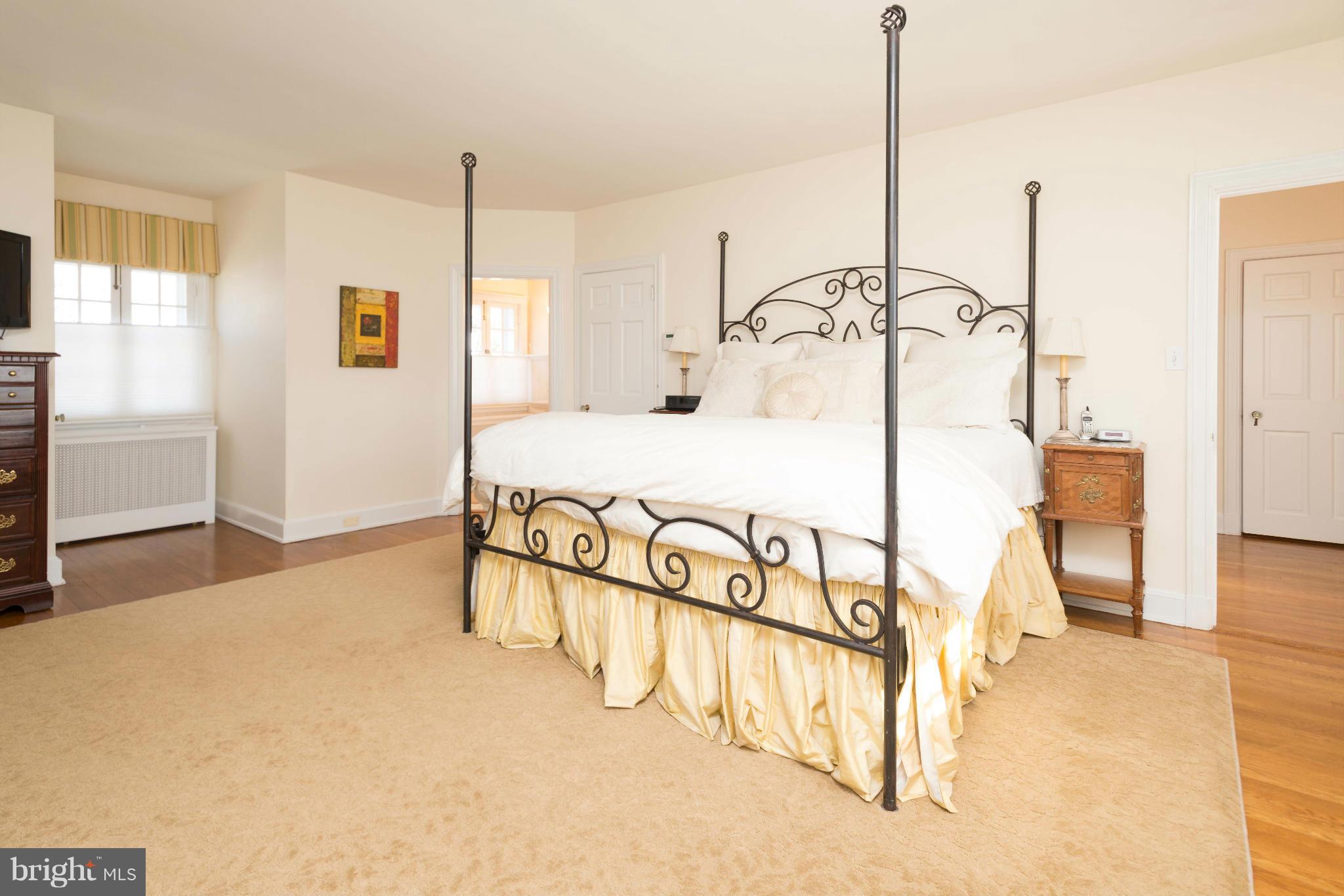 207 Witherspoon Road Baltimore, MD 21212 - Photo 16 of 28 a bedroom with a bed and ceiling fan