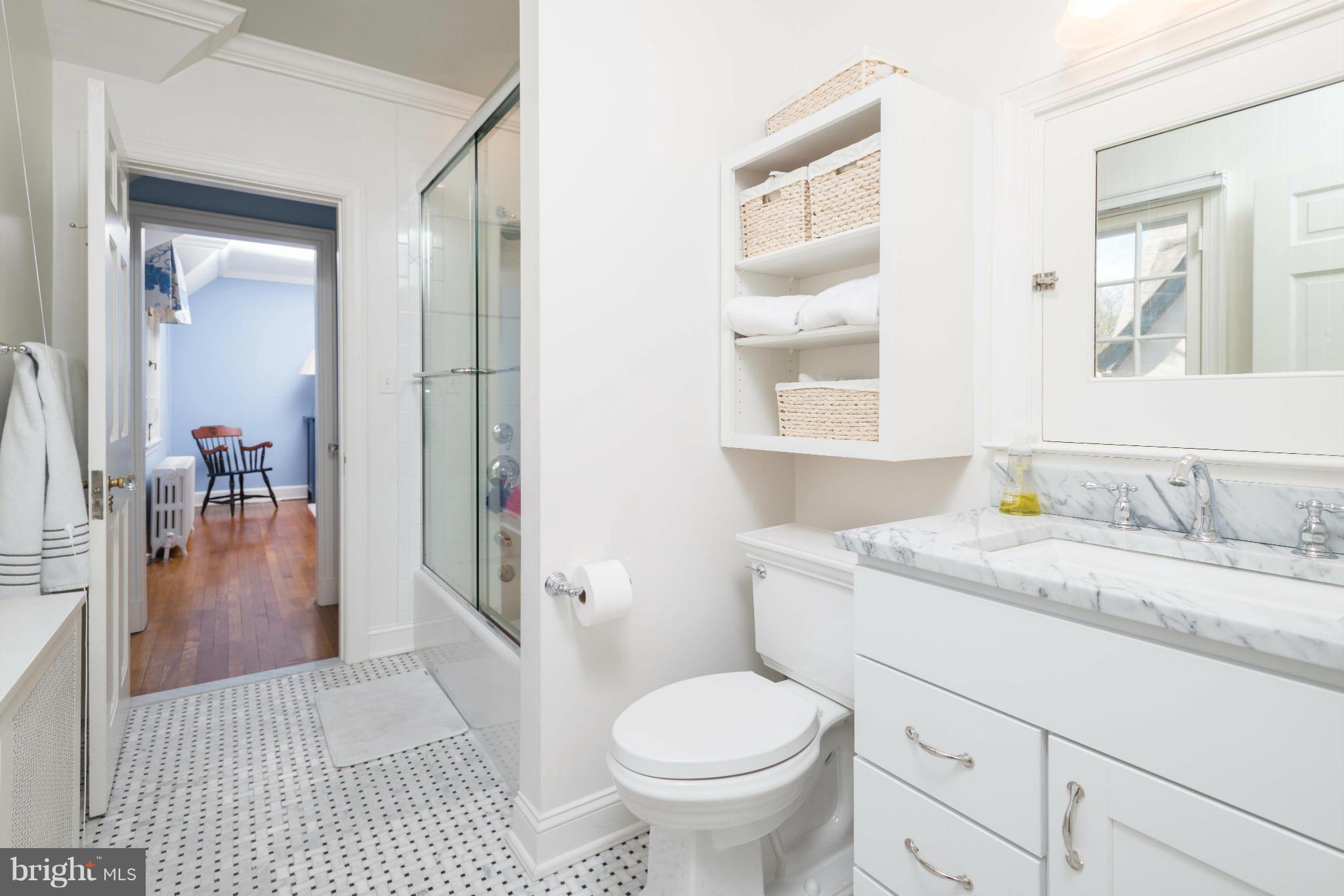 207 Witherspoon Road Baltimore, MD 21212 - Photo 21 of 28 a bathroom with a granite countertop toilet sink and mirror