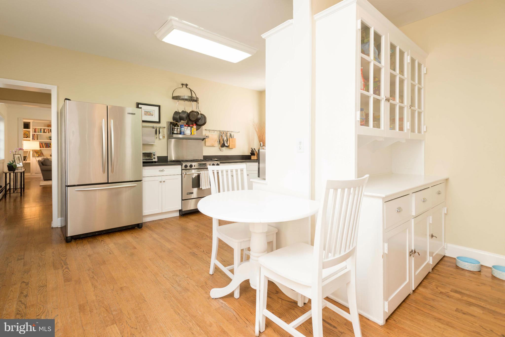 207 Witherspoon Road Baltimore, MD 21212 - Photo 9 of 28 a kitchen with stainless steel appliances a refrigerator and a stove