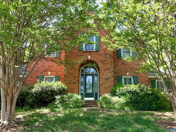 front view of a house with a garden