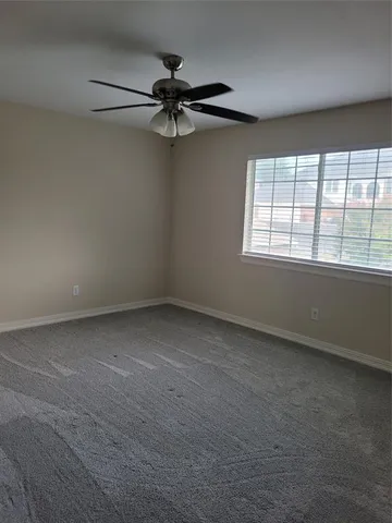 a view of room window and wooden floor