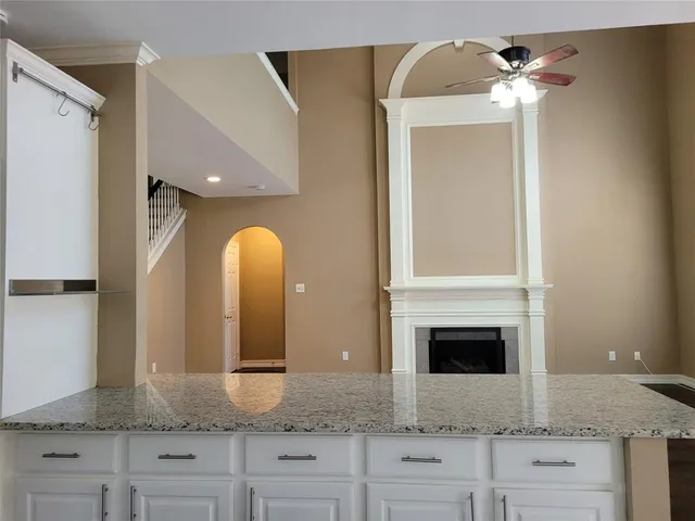 a kitchen with stainless steel appliances a sink and a refrigerator