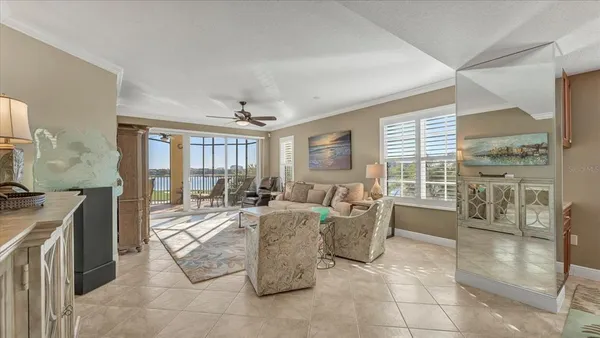 a living room with furniture and a large window