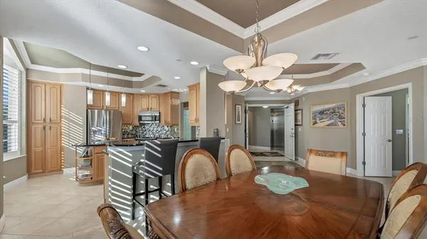 a kitchen with stainless steel appliances a sink and a refrigerator