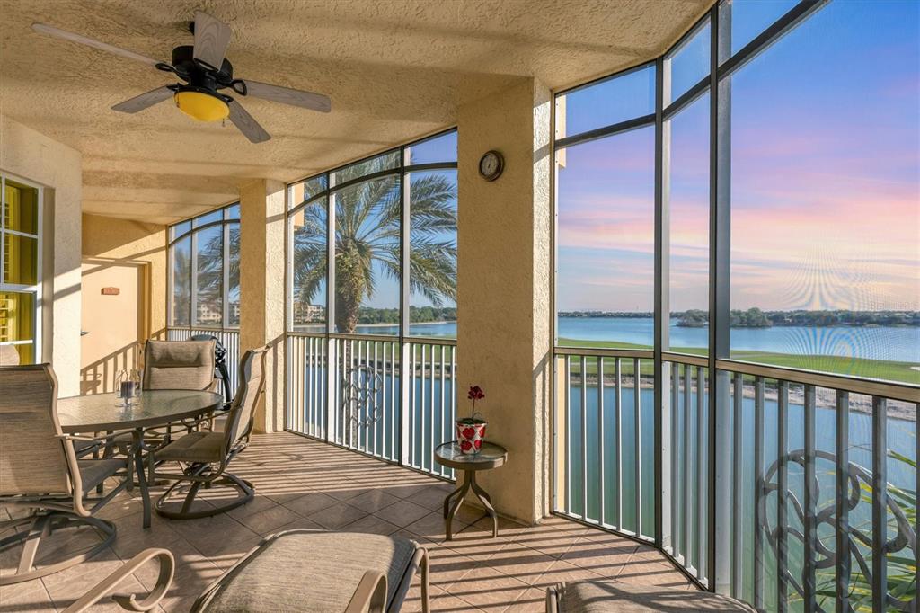 6414 Water Crest Way, Unit 302 Lakewood Ranch, FL 34202 - Photo 2 of 74 a bedroom with furniture and large windows