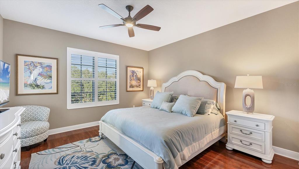 6414 Water Crest Way, Unit 302 Lakewood Ranch, FL 34202 - Photo 34 of 74 a bedroom with a large bed and a window