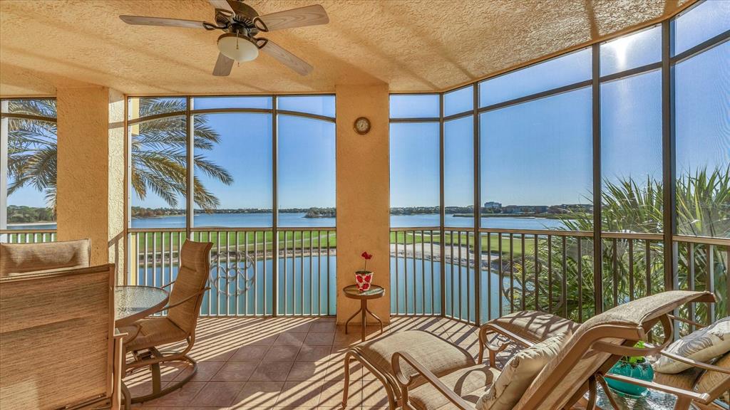 6414 Water Crest Way, Unit 302 Lakewood Ranch, FL 34202 - Photo 43 of 74 a balcony view with a couch and wooden floor