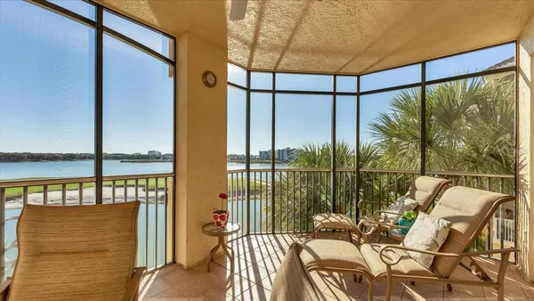 a kitchen with granite countertop a sink stainless steel appliances cabinets and a window