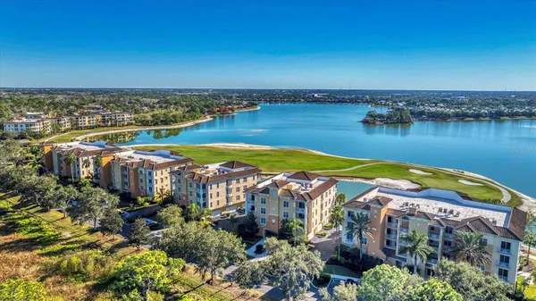 an aerial view of a house with a lake view