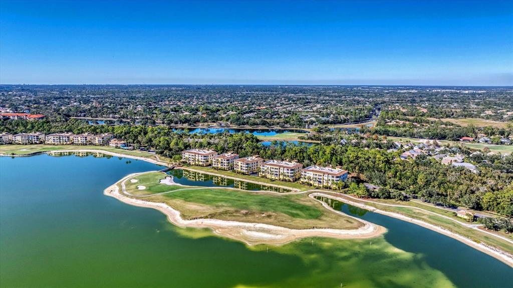 6414 Water Crest Way, Unit 302 Lakewood Ranch, FL 34202 - Photo 53 of 74 an aerial view of a residential houses with outdoor space and swimming pool