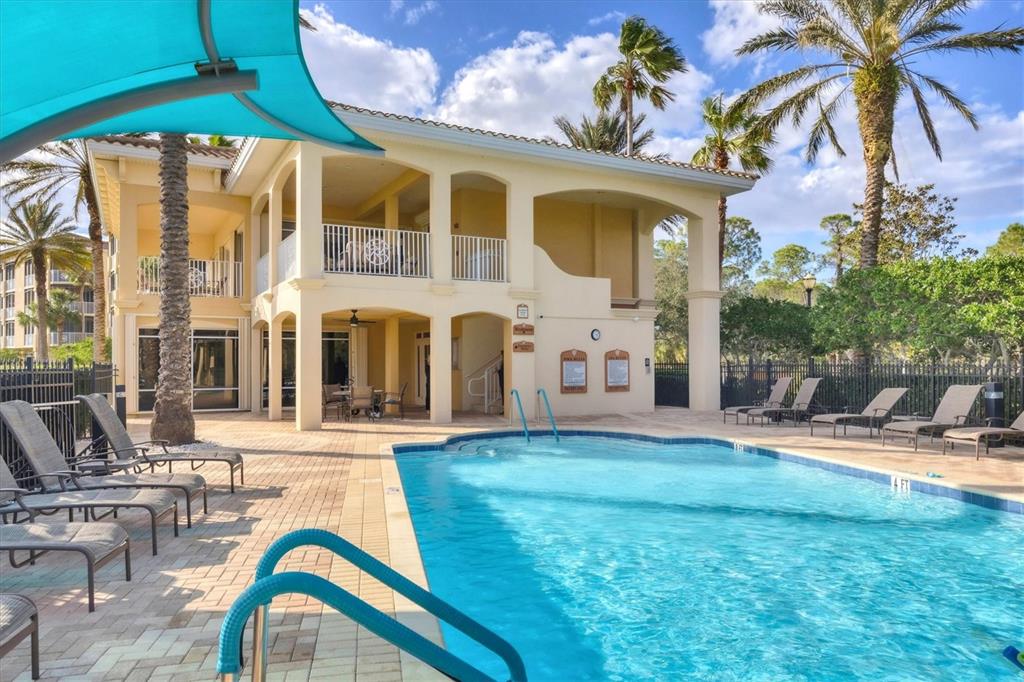 6414 Water Crest Way, Unit 302 Lakewood Ranch, FL 34202 - Photo 71 of 74 a view of a house with backyard porch and sitting area