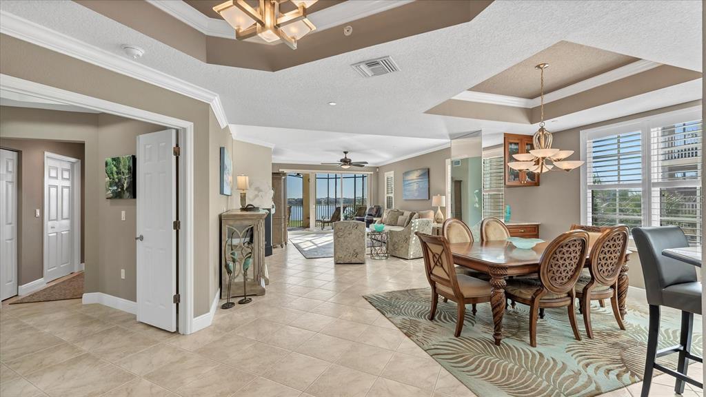 6414 Water Crest Way, Unit 302 Lakewood Ranch, FL 34202 - Photo 9 of 74 a view of a dining room with furniture