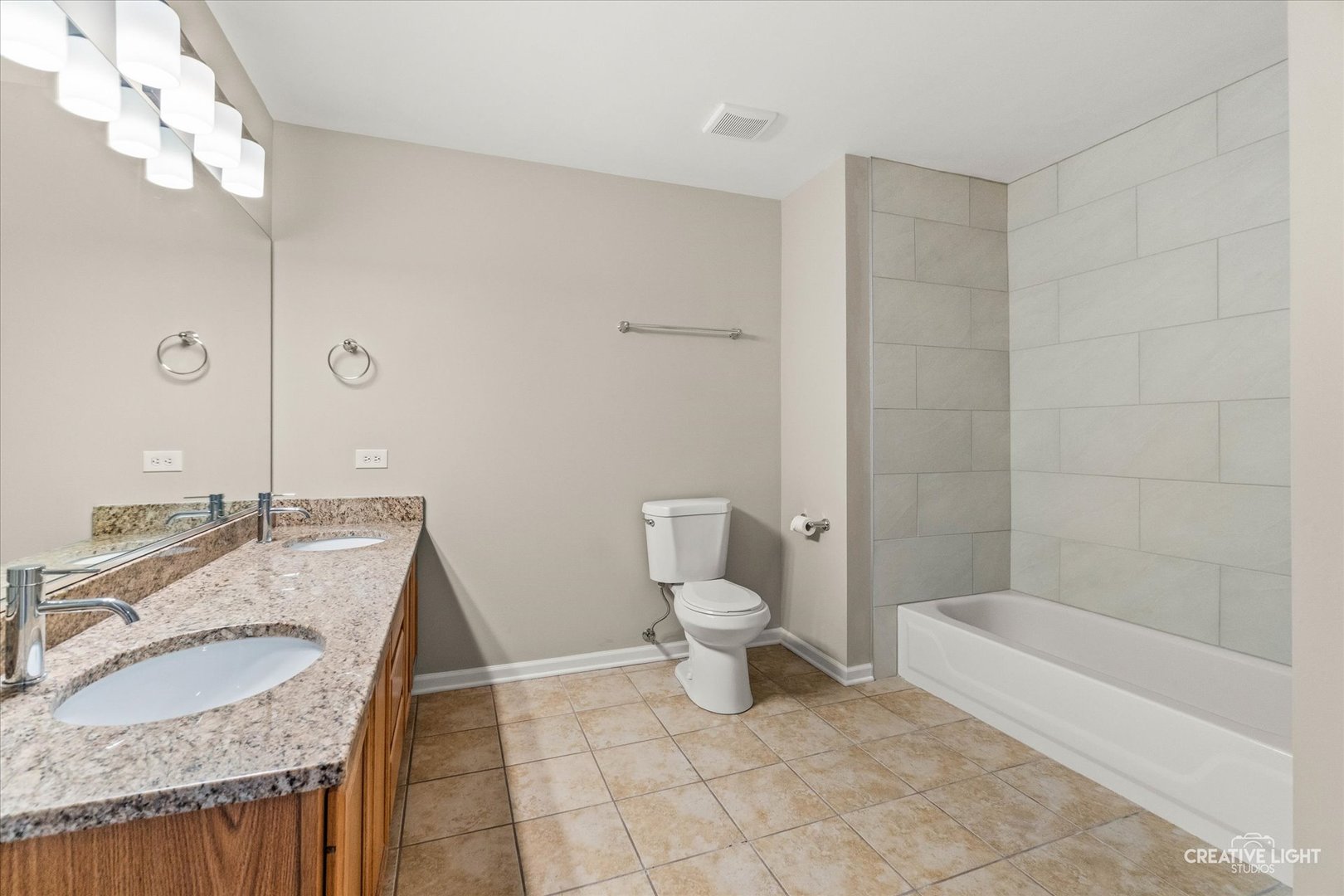 862 North 1st Street, Unit 862 Elburn, IL 60119 - Photo 16 of 32 a bathroom with a granite countertop sink a toilet and bathtub