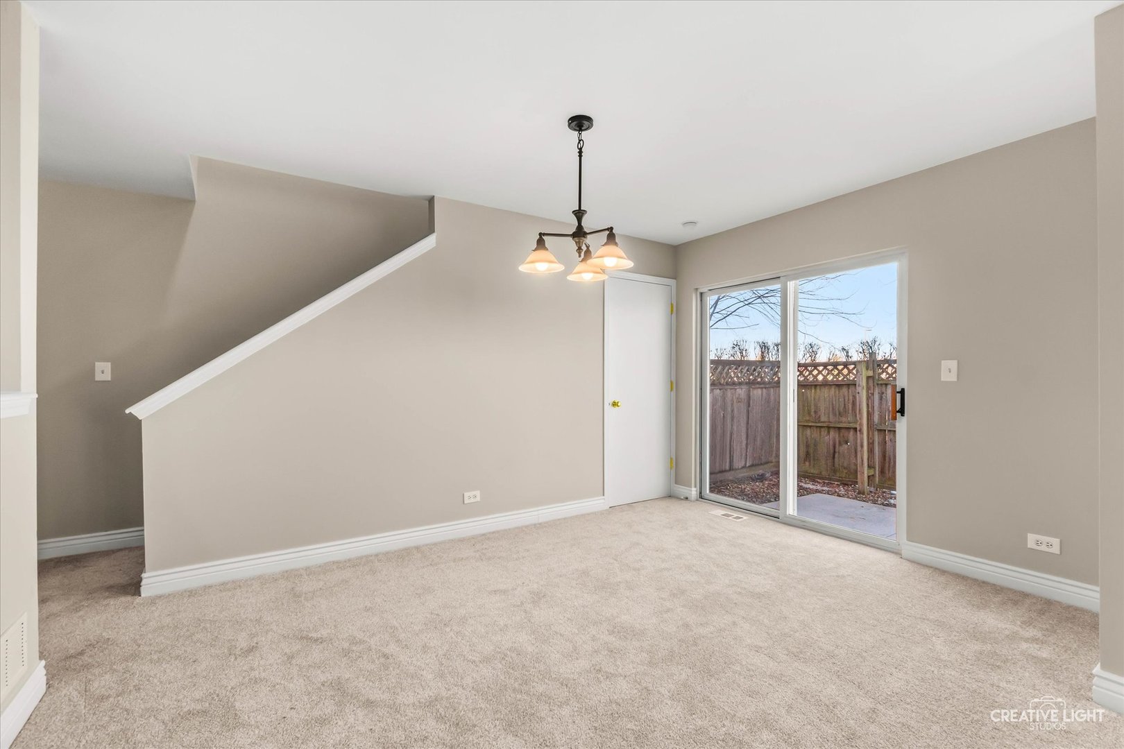 862 North 1st Street, Unit 862 Elburn, IL 60119 - Photo 6 of 32 a view of a room with a chandelier fan and windows