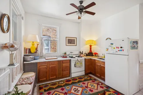 a kitchen with a sink appliances and cabinets