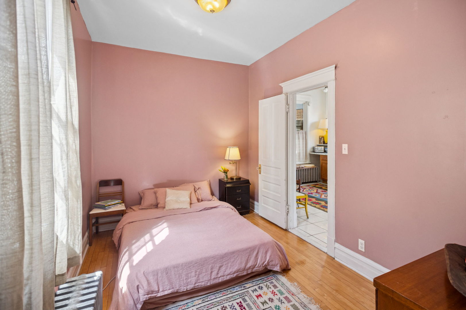 3226 West Thomas Street Chicago, IL 60651 - Photo 16 of 28 a bedroom with a bed and a dresser with rug