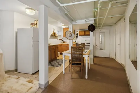 a kitchen with stainless steel appliances granite countertop a stove and a refrigerator