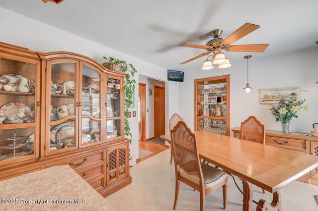 a bedroom with two beds and a chandelier