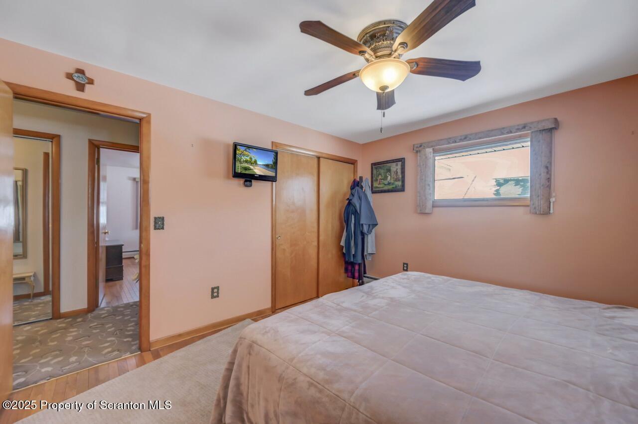 216 Prospect Street Dunmore, PA 18512 - Photo 18 of 81 a bed room with a bed and a ceiling fan