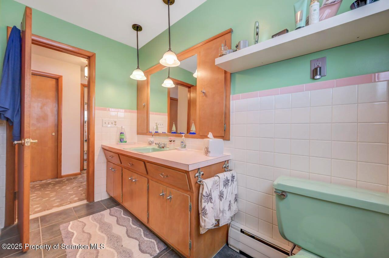 216 Prospect Street Dunmore, PA 18512 - Photo 20 of 81 a bathroom with a sink and a mirror